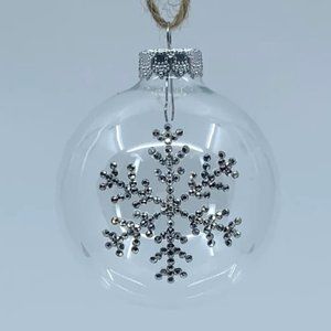 Round plastic Christmas ornament. Handmade silver rhinestone snowflake design.
